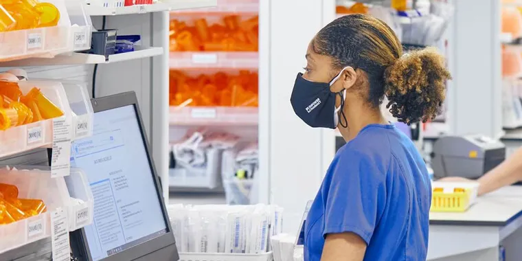 Pharmacist working at a computer